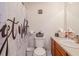 Charming bathroom includes a toilet, vanity and sink, complete with a quirky shower curtain at 2951 N Mckoy Rd, Villa Rica, GA 30180