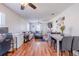 Open-concept living and dining area featuring hardwood floors, a ceiling fan and lots of natural light at 2951 N Mckoy Rd, Villa Rica, GA 30180