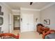 Neutral bedroom featuring two twin beds, a ceiling fan, and access to an adjacent room at 624 Hemlock Trl, Canton, GA 30114