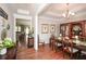 Elegant dining room with hardwood floors, chandelier, and a large wooden china cabinet at 624 Hemlock Trl, Canton, GA 30114