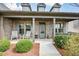 Inviting covered front porch with chairs and decorative elements creating a warm entry at 624 Hemlock Trl, Canton, GA 30114