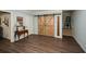 Well-lit living area featuring hardwood floors and unique barn doors at 624 Hemlock Trl, Canton, GA 30114