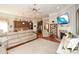 Inviting living room with a fireplace, complemented by an adjacent modern kitchen and hardwood floors at 624 Hemlock Trl, Canton, GA 30114