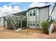 Exterior view showcases a deck, a sunroom, a well-maintained backyard, and a multi-story house at 624 Hemlock Trl, Canton, GA 30114