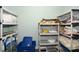 Organized storage room with plastic shelving units, ideal for maximizing space and tidiness at 624 Hemlock Trl, Canton, GA 30114