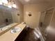 Bathroom with a sink, a shower, and standard toilet fixtures at 708 Raven Springs Trl, Stone Mountain, GA 30087