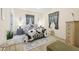 Cozy bedroom with a decorative rug, matching end tables and black and white bedding at 509 Chestnut Oak Dr, Palmetto, GA 30268