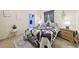 Comfortable bedroom featuring stylish bedding and decor, with a bedside table and plant at 509 Chestnut Oak Dr, Palmetto, GA 30268