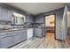 Modern kitchen with stainless steel appliances, and a view into the living area at 509 Chestnut Oak Dr, Palmetto, GA 30268