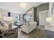 Bright living room with modern furnishings and a stone fireplace at 509 Chestnut Oak Dr, Palmetto, GA 30268