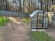 Fenced backyard with a garden house at 625 Huiet Dr, Mcdonough, GA 30252