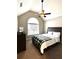 Comfortable bedroom with a plush bed, vaulted ceilings, and large window for natural light at 625 Huiet Dr, Mcdonough, GA 30252