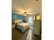 Cozy bedroom with a teal accent wall and carpet at 625 Huiet Dr, Mcdonough, GA 30252