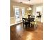 Breakfast nook featuring a round table with chairs, French doors to the outside, and hardwood flooring at 625 Huiet Dr, Mcdonough, GA 30252