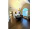 Elegant dining room with hardwood floors, chandelier, and wainscoting at 625 Huiet Dr, Mcdonough, GA 30252