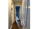 Inviting hallway with hardwood floors and doorways leading to other rooms of the house at 625 Huiet Dr, Mcdonough, GA 30252