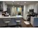 Well-equipped kitchen with white cabinets, stainless steel appliances, island seating, and plenty of counter space at 625 Huiet Dr, Mcdonough, GA 30252