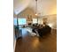 Bright living room featuring hardwood floors, fireplace, and vaulted ceiling at 625 Huiet Dr, Mcdonough, GA 30252