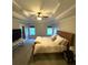 Comfortable main bedroom with tray ceilings, a fan, lots of natural light, and a cozy bed offers a peaceful retreat at 625 Huiet Dr, Mcdonough, GA 30252