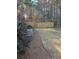 View of the edge of the lawn with a small wooded area at 625 Huiet Dr, Mcdonough, GA 30252