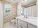 Bathroom with floral wallpaper, a vanity, and a shower-tub combo at 120 Pine Mist Cir, Alpharetta, GA 30022