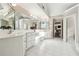 Bright bathroom with tiled floor, large mirrors, and dual sinks at 120 Pine Mist Cir, Alpharetta, GA 30022