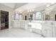 Bright bathroom with tiled floor, large mirrors, and dual sinks at 120 Pine Mist Cir, Alpharetta, GA 30022