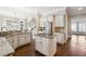 A well-appointed kitchen featuring granite countertops, a center island, and stainless steel appliances at 120 Pine Mist Cir, Alpharetta, GA 30022