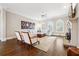 Elegant living room featuring a fireplace, hardwood floors, and bright windows at 120 Pine Mist Cir, Alpharetta, GA 30022