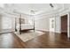 A spacious primary bedroom featuring hardwood floors, a ceiling fan, and lots of natural light at 120 Pine Mist Cir, Alpharetta, GA 30022