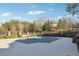 Covered outdoor swimming pool with manicured grounds and mature trees at 120 Pine Mist Cir, Alpharetta, GA 30022