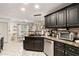 Modern kitchen with stainless steel appliances and granite countertops at 1252 Highfield Dr, Lawrenceville, GA 30043