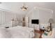 Bright main bedroom with wood floors, decorative wall trim, and a chandelier at 1252 Highfield Dr, Lawrenceville, GA 30043