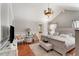 Spacious main bedroom features a chandelier, sitting area, and decorative wall trim at 1252 Highfield Dr, Lawrenceville, GA 30043