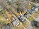 Wide aerial view showcasing the property's location within a leafy neighborhood, with surrounding homes and yards at 1891 W Forrest Ave, Atlanta, GA 30344