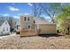 Backyard featuring a wooden deck, green grass, and sunny sky at 1891 W Forrest Ave, Atlanta, GA 30344