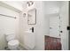 Modern bathroom featuring a sleek black faucet, stylish mirror, and patterned tile floor at 1891 W Forrest Ave, Atlanta, GA 30344