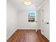 Bedroom with wood floors, window, and two doorways at 1891 W Forrest Ave, Atlanta, GA 30344