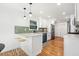 Modern kitchen with white cabinets, quartz countertops, and stainless-steel appliances at 1891 W Forrest Ave, Atlanta, GA 30344