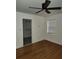 Bright bedroom with hardwood floors, a ceiling fan, and a walk-in closet at 2791 Allegro Nw Dr, Atlanta, GA 30318