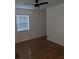 Bright bedroom with hardwood floors, a ceiling fan, and a window at 2791 Allegro Nw Dr, Atlanta, GA 30318