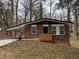 Charming brick home featuring an attached carport and a neatly landscaped front yard at 2791 Allegro Nw Dr, Atlanta, GA 30318