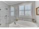 Elegant primary bathroom with glass-enclosed shower and luxurious soaking tub at 2880 Stonehall Ct # 2, Atlanta, GA 30339