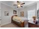 Cozy bedroom featuring a ceiling fan, natural light, and neutral paint at 2880 Stonehall Ct # 2, Atlanta, GA 30339