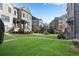 Expansive green lawn in front of townhome exteriors with walkways and landscaping at 2880 Stonehall Ct # 2, Atlanta, GA 30339