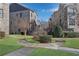 Well-manicured front lawn with sidewalks between townhomes at 2880 Stonehall Ct # 2, Atlanta, GA 30339