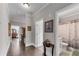 Well-lit hallway with hardwood floors, crown molding, and doorways leading to bedrooms and bathrooms at 2880 Stonehall Ct # 2, Atlanta, GA 30339