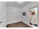 Hallway featuring wainscoting walls and a view of a bathroom with a granite countertop at 2880 Stonehall Ct # 2, Atlanta, GA 30339