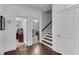 Hallway featuring wainscoting walls and entrances to an office, exercise room, and stairs at 2880 Stonehall Ct # 2, Atlanta, GA 30339