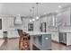 Modern kitchen with stainless steel appliances, center island, and white cabinets at 2880 Stonehall Ct # 2, Atlanta, GA 30339